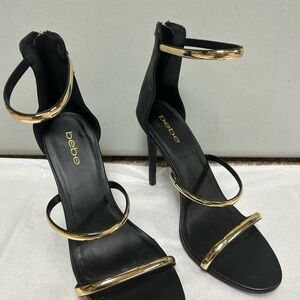 bebe Black and Gold Strappy High Heel Sandals